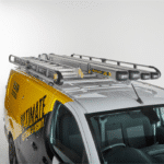 Commercial van equipped with an UltiRack heavy-duty roof rack for secure ladder and equipment storage.